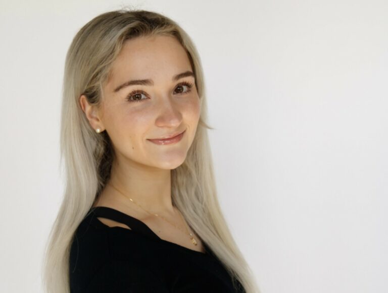 Headshot Emily Greenslit 2 1 1 768x581